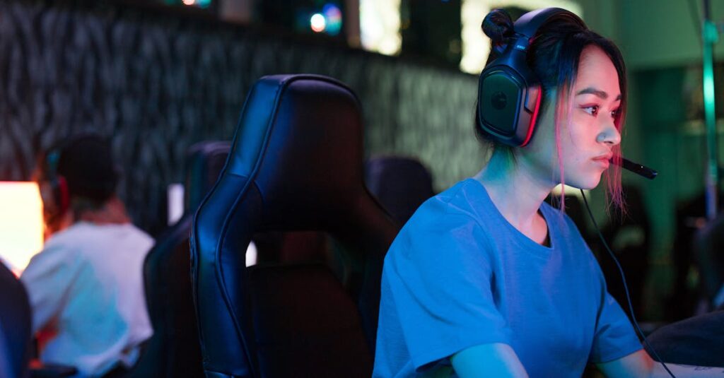 A woman intensely gaming on a computer in a vibrant tech setup, highlighting concentration and modern gaming culture.